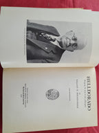 Open book with a portrait and title page of 'Helldorado' by William M. Breakenridge on a red background.
