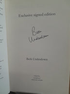 A close-up of a book's title page for 'Exclusive signed edition' by Beth Underdown, featuring a handwritten signature in black ink and the Viking imprint logo at the bottom.