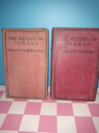 Two books titled 'The Return of Tarzan' and 'The Beasts of Tarzan' on a checkered background.